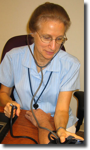 Wellness Nurse taking blood pressure